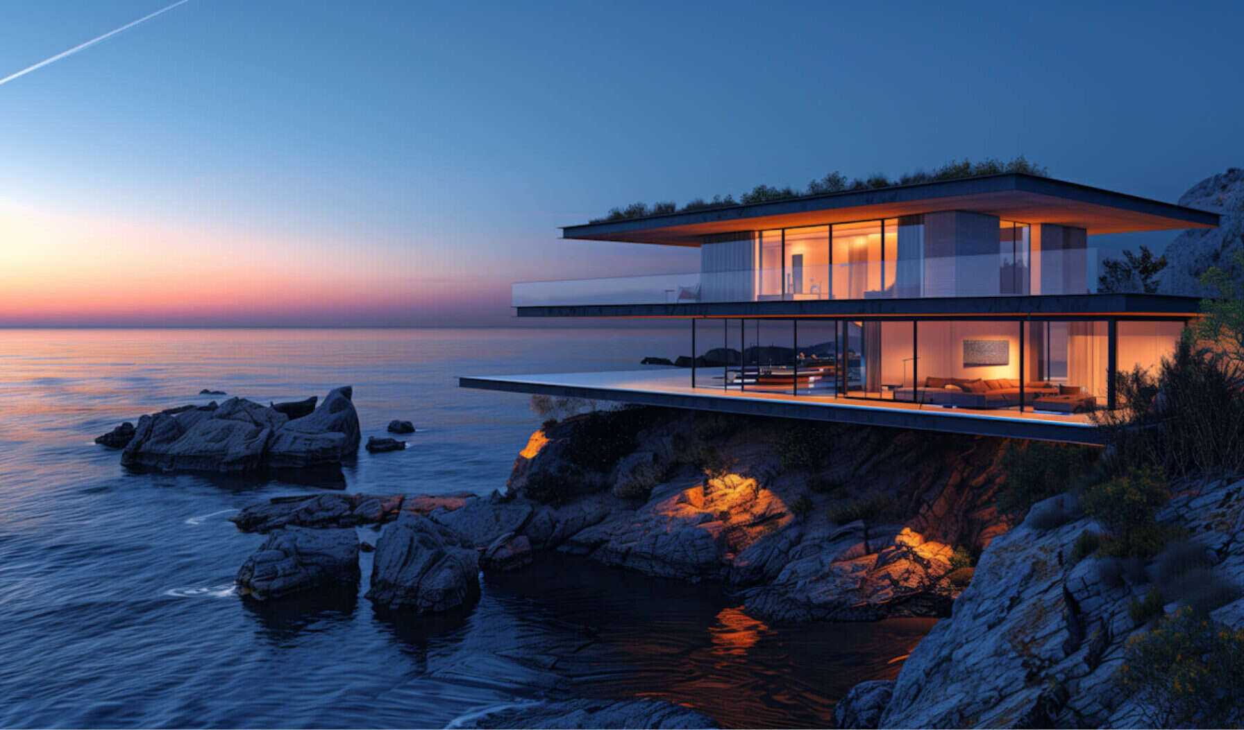 Modern house on rocks by the sea at dusk