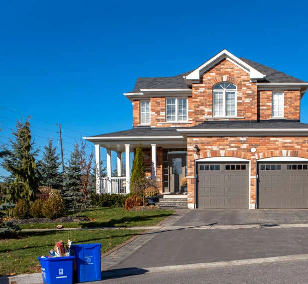 Brick house with a porch and garage