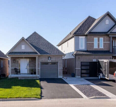 Grey suburban house with a driveway