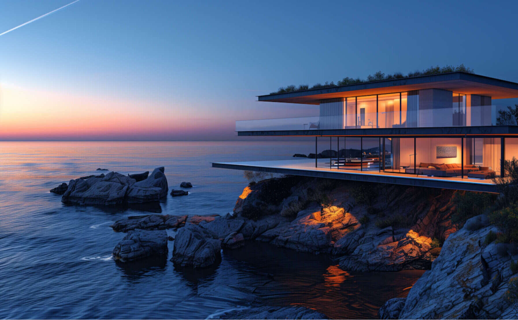 Modern glass house on a cliff above the sea at dusk